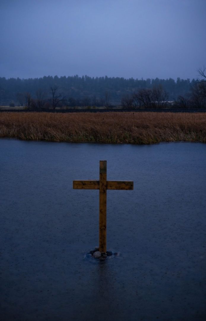 Roadside cross at Park City in the rain